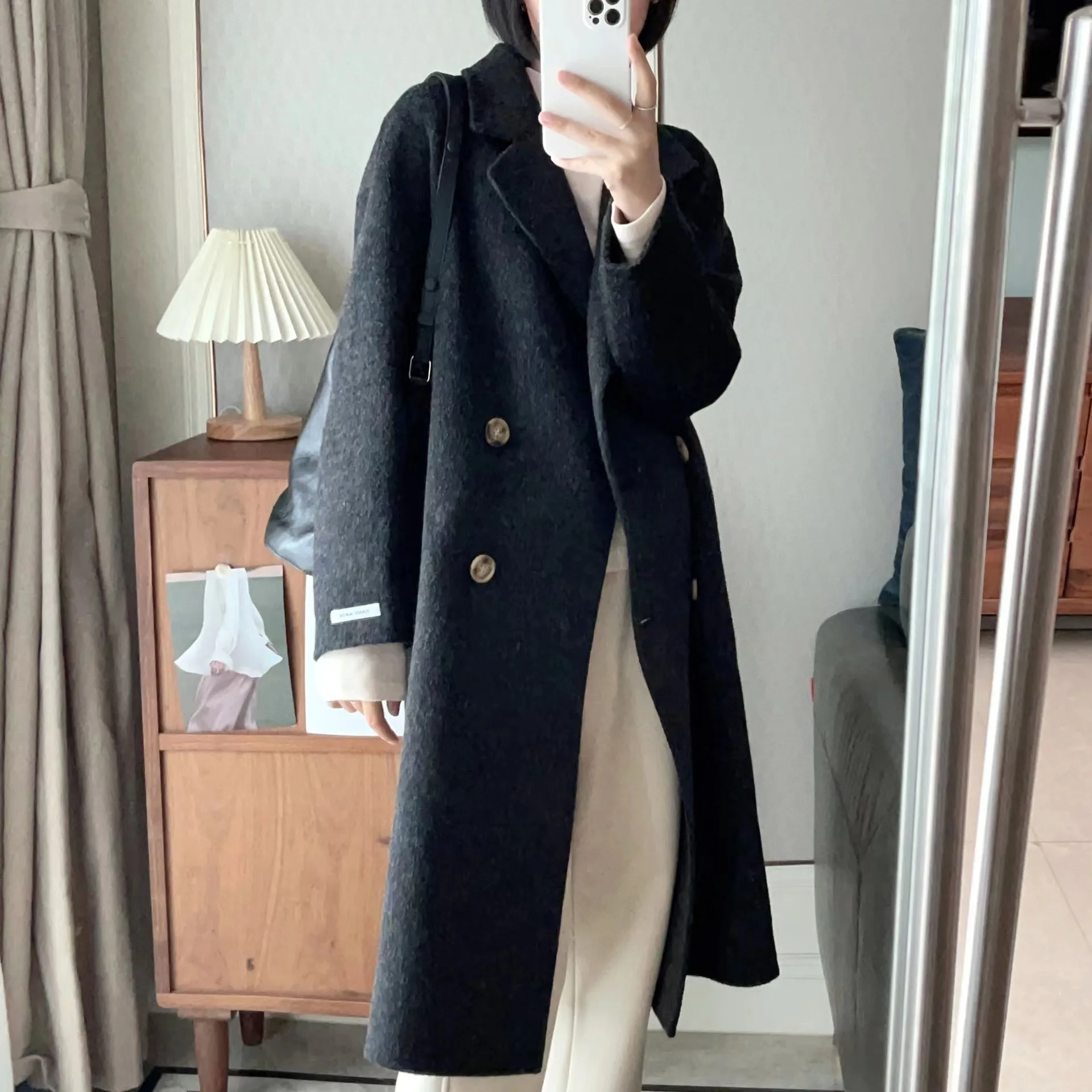 2025 Cappotto di lana con petto abbassato da donna primaverile Cappotto invernale in cashmere stile sciolto Cappotti lunghi Top Nuovo