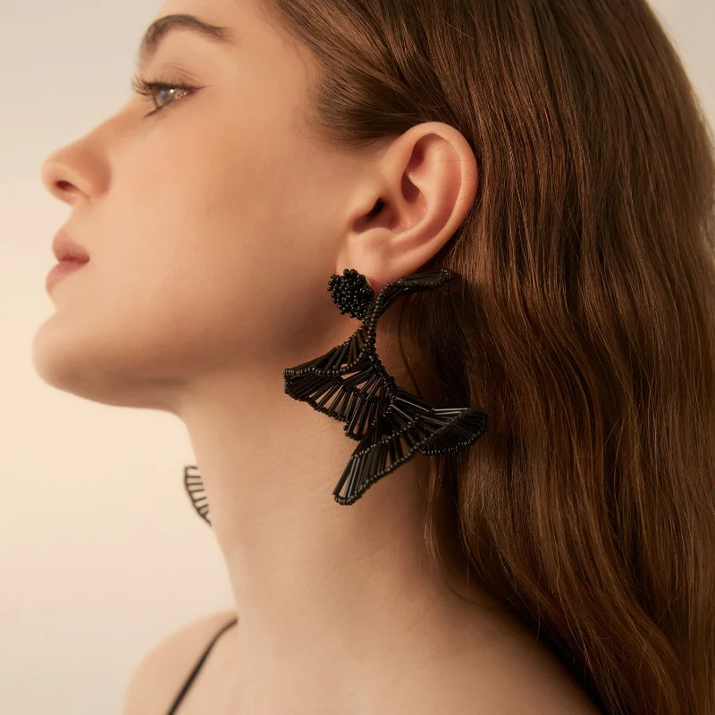 Retro court fan-shaped earrings for women, exuding a refined and elegant charm. Delicate fringes on a long design, making it an