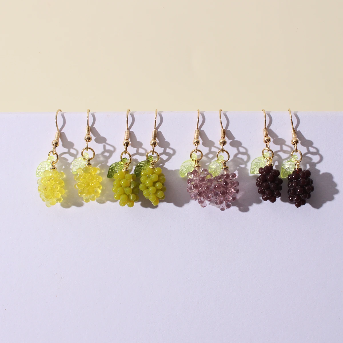 A pair of fresh and transparent faux fruit and grape resin earrings with a sweet and cute design are suitable for daily wear