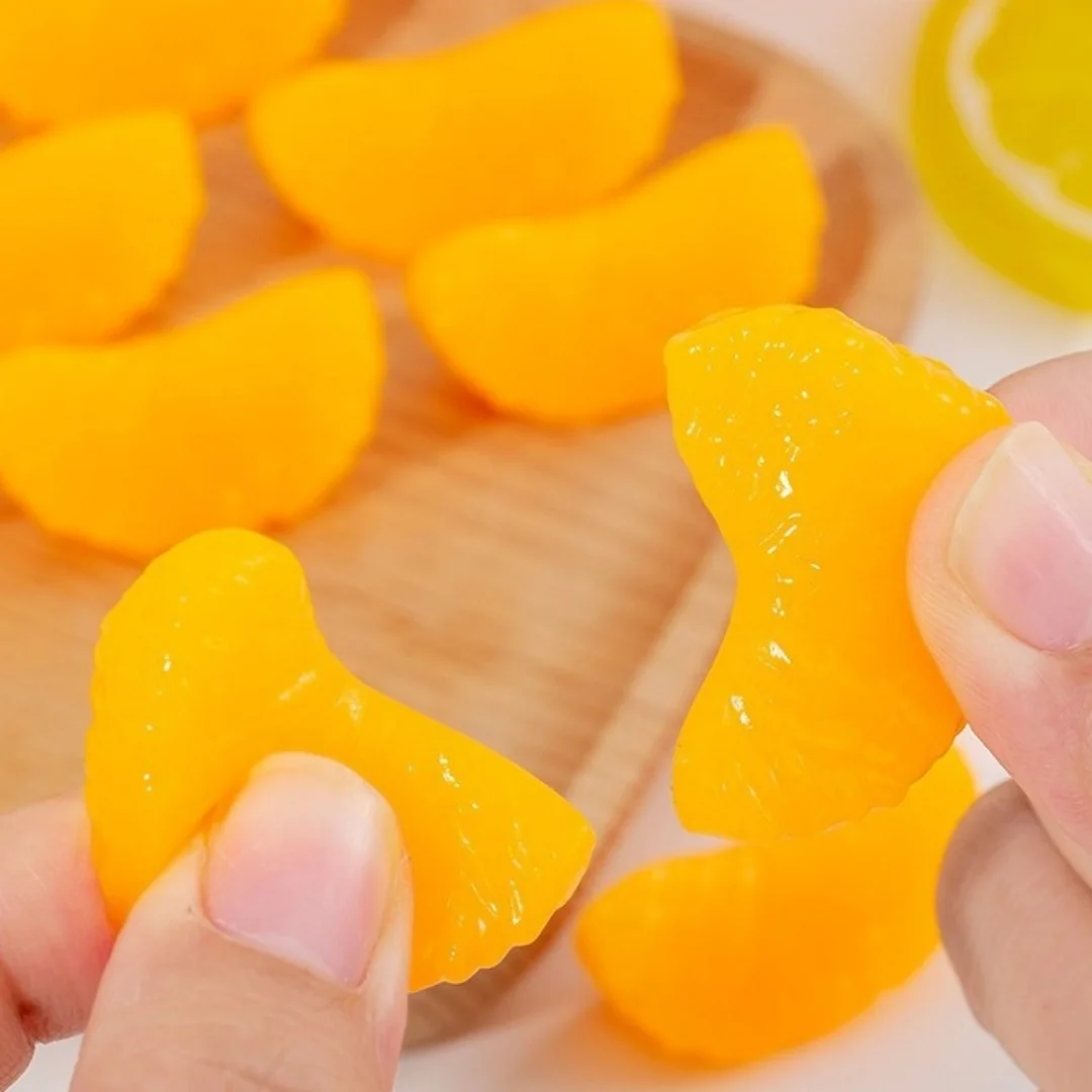 Simulated orange soft rubber slow rebound stress relief gadget for desktop venting. Super realistic fruit-shaped decorative item.