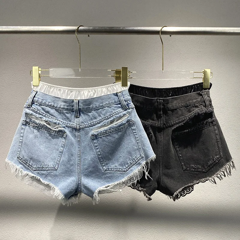 2025 nuova nicchia per fare vecchi jeans strappati con bordo grezzo falsi due pezzi di pantaloncini patchwork da donna pantaloni corti da donna