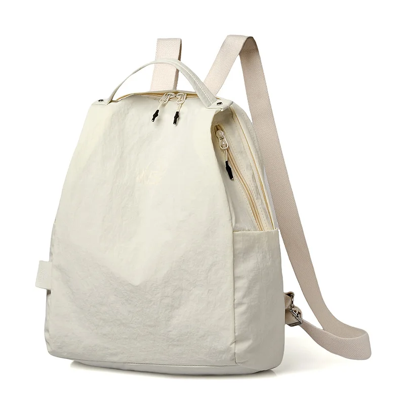 حقيبة ظهر نسائية عصرية متعددة الاستخدامات لعام 2026 حقيبة ظهر كاجوال بسيطة مقاومة للماء من قماش النايلون بتصميم بلون سادة