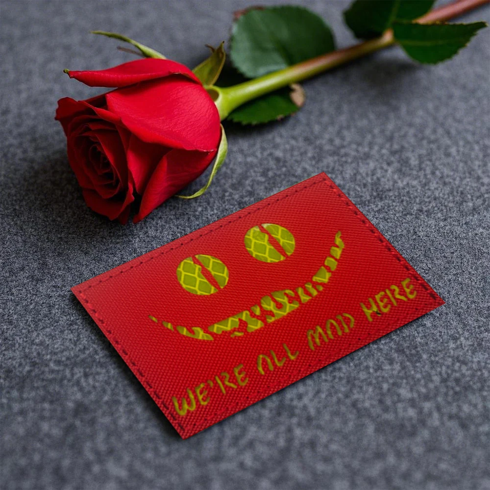 

WE'RE ALL MAD HERE Tactical Emblem Cheshire Cat's Eye Glow On the Dark Reflective Patches For Jacket Shoulder DIY Sew-on