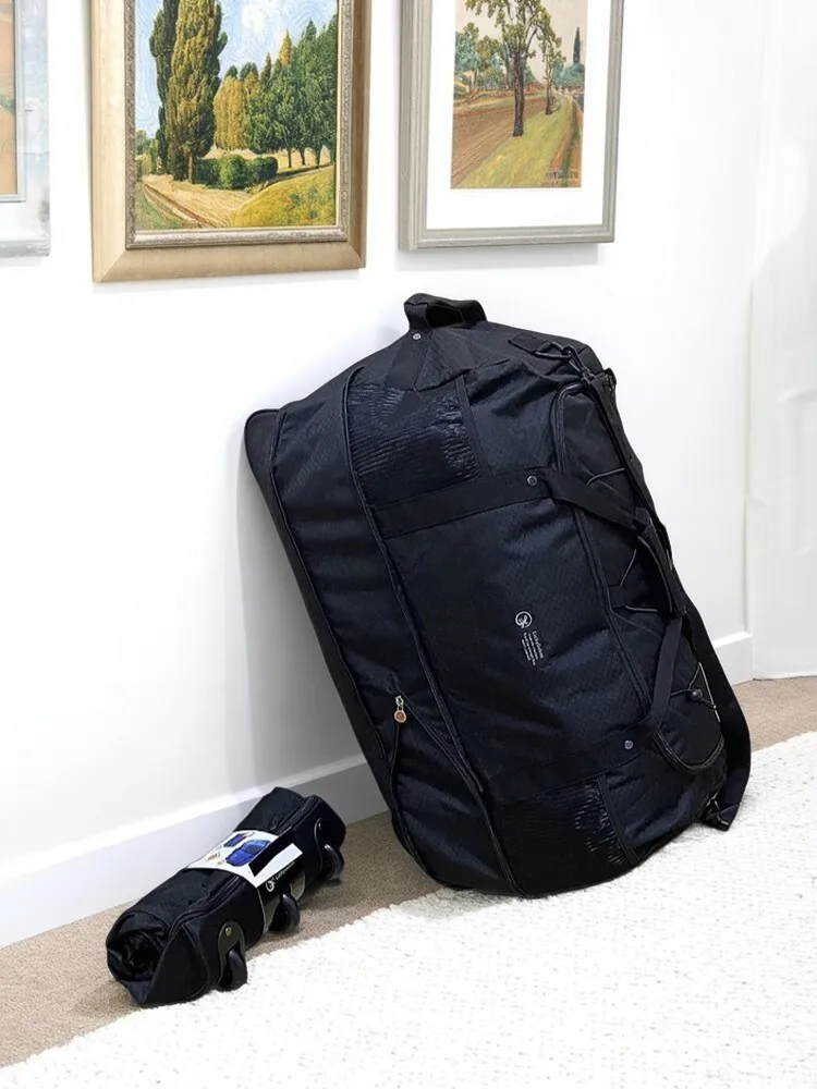 

Large Capacity 125L Ultralight 1.4kg Foldable Rolling Luggage Bag - Water-Resistant Camping Storage, Spacious Travel Duffel