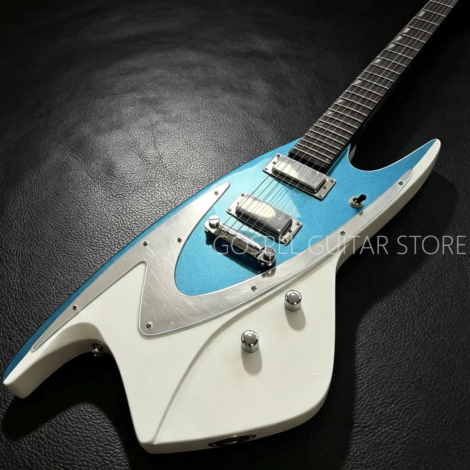 Electric Guitar - Contrasting Color of Metallic Blue and Ivory White for the Body, Silver Metal Guard Plate, Double-Coil Pickups, Chrome Fixed Bridge, Rosewood Fingerboard, Diamond-Shaped Inlay, Sealed Tuning PEGS, Silver hardware.
