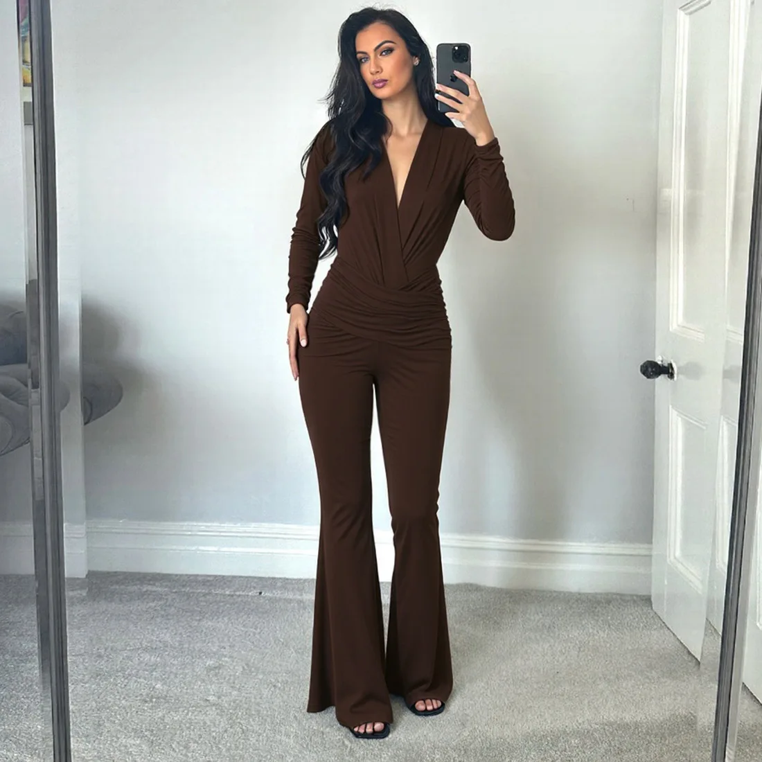 

New European and American women's fashion solid color sexy deep V fold waist long sleeve slim jumpsuit women's clothing