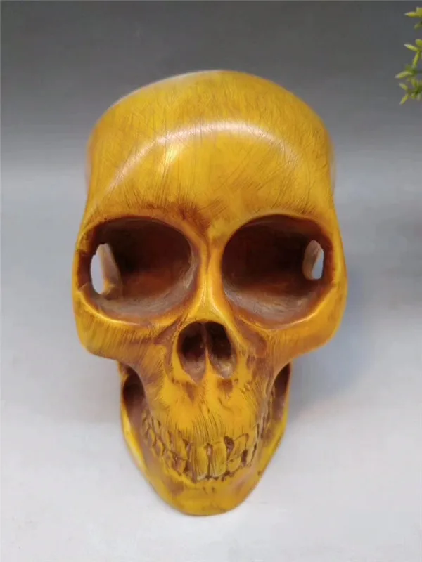 Artifact bone carving 19026, skull width 7.8, height 10.7 centimeters, weight 700 grams