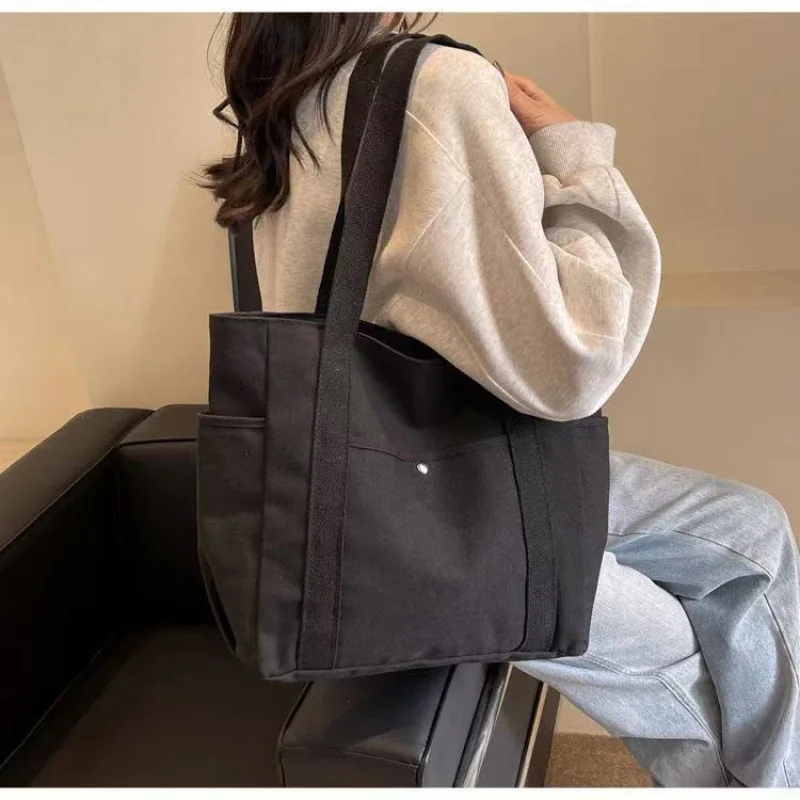 

New Canvas Women's Bag Large Capacity Multiple Outer Pocket Zipper Shoulder Bag Student Handbag Shopping Bag Student Bag