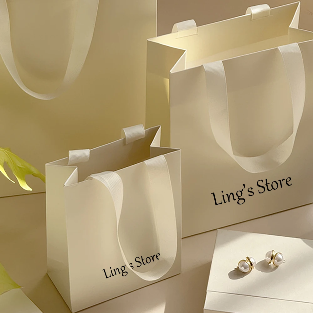 

100Pcs Lovely Personalized Logo Jewelry Paper Handle Bag Shopping Gift Handbag Cosmetic Perfume Wedding Favors Candy Organizer
