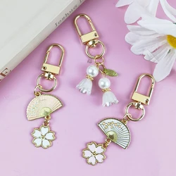 Cute Lily Of The Valley Flower Keychain Sweet Metal Sakura Fan Shape Keyring Women Car Key Holder Earphone Case Decor Girl Gifts