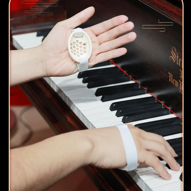 

Piano hand shape corrector for beginners. Eggshell-shaped piano finger training aid. Musical instrument accessories
