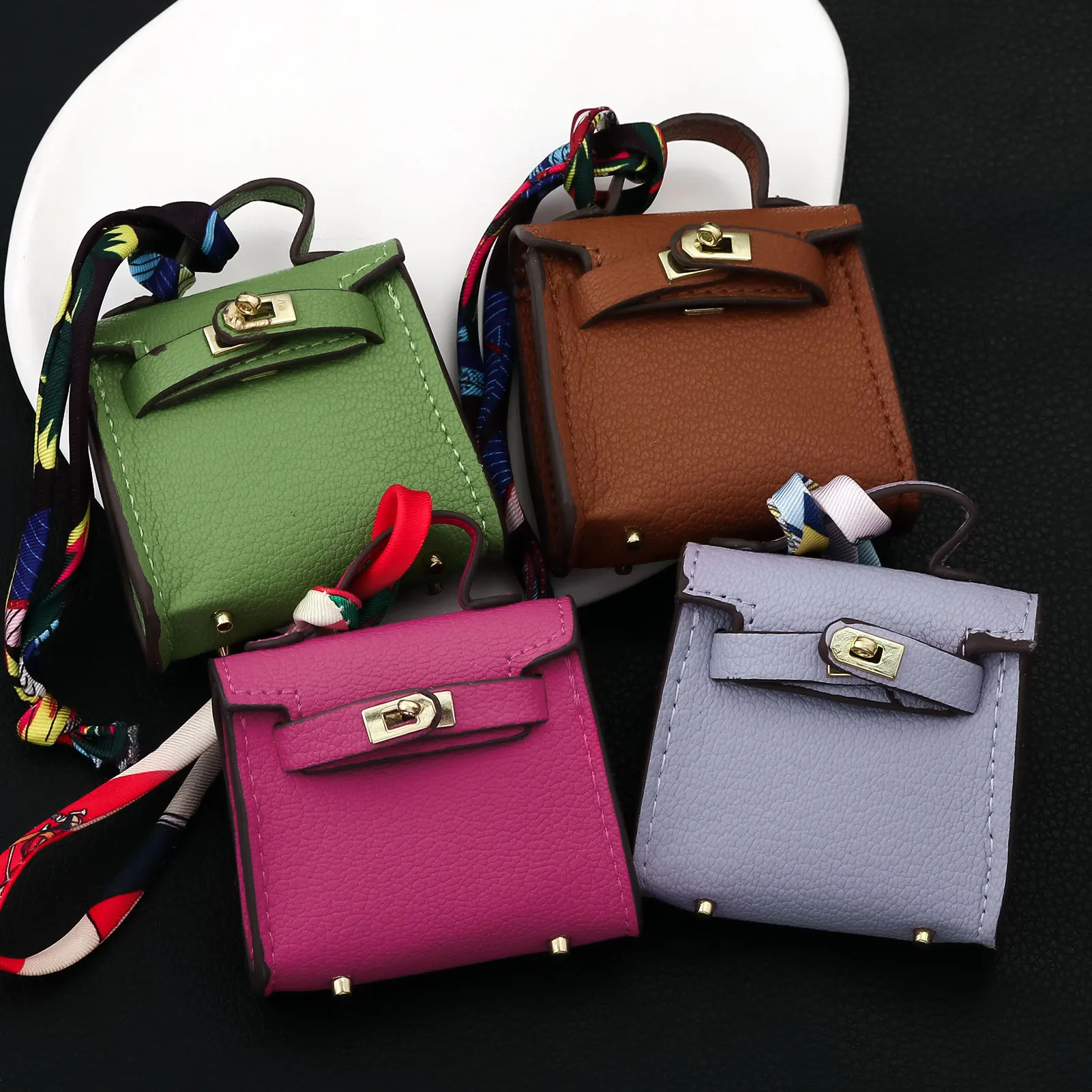 حقيبة صغيرة كيلي لأحمر الشفاه حقيبة سماعة الرأس حقيبة لطيفة شريط معلق حقيبة سلسلة مفاتيح ساحرة للنساء بلون سادة حقيبة أنيقة ملحقات هدية