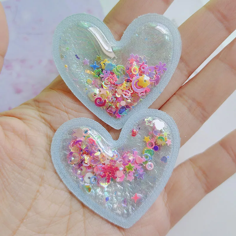 20pcs PVC Quicksand Cartoon Heart trasparente Bling Flowing patch Appliques per accessori per fascia per bambini fai da te