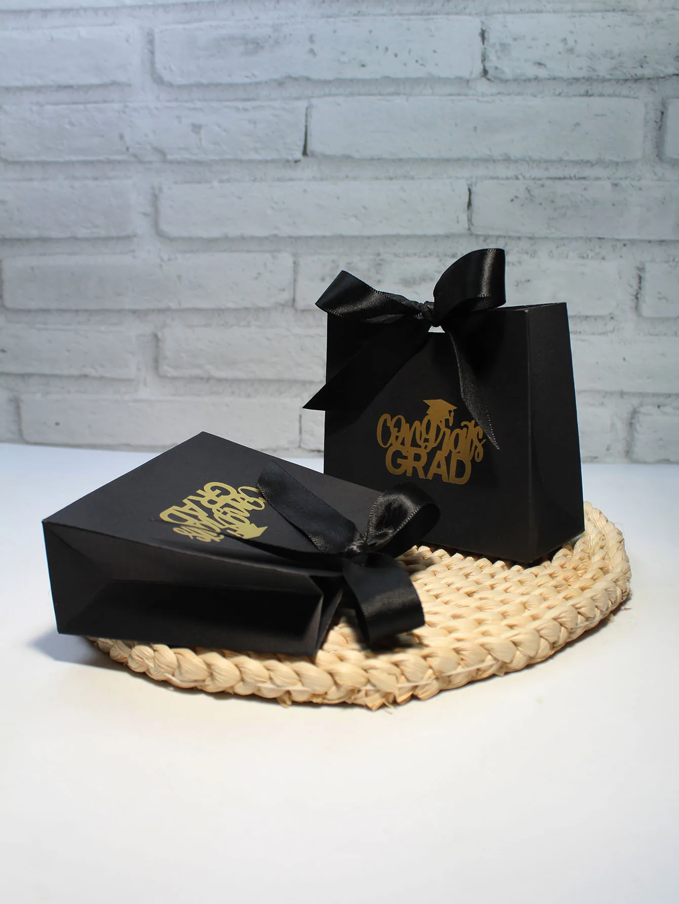 Sophisticated Black 'Grad' Gift Boxes with Gold Foil Script and Satin Ribbons - Ideal for Celebrating Academic Achievements