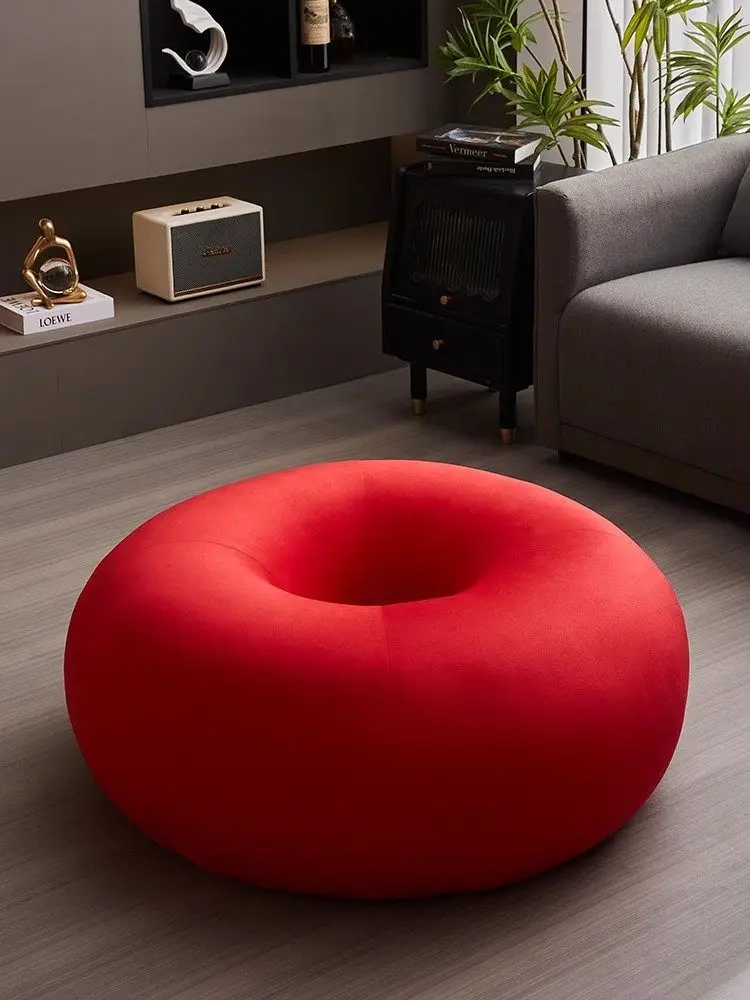 Donut living room sofa next to floor ornament