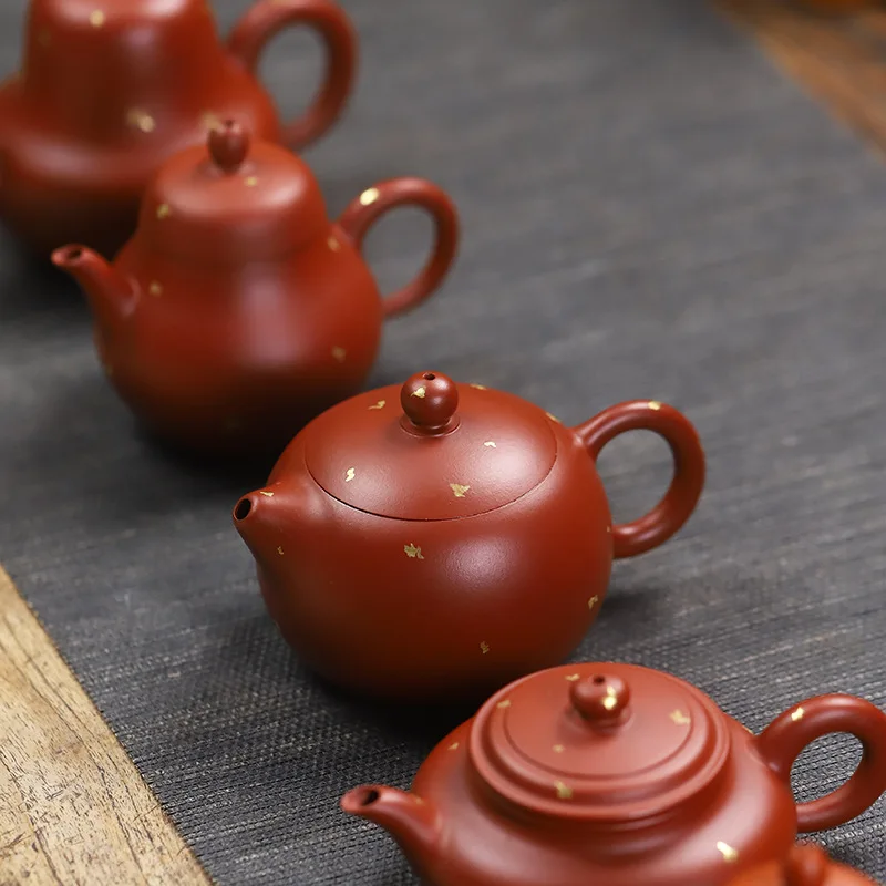 

Manufacturer wholesale Zisha pot Yixing hand-sprinkled gold teapot small capacity singlepot Zhu Ni Dahongpao Kung Fu tea set
