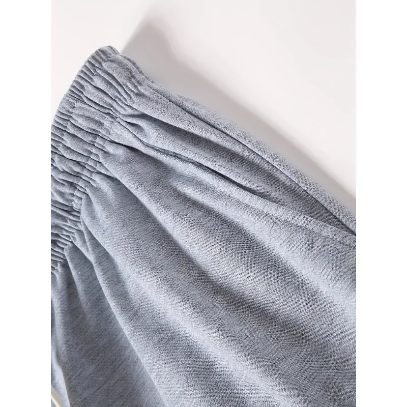 As calças esportivas de perna reta de cor sólida são adequadas para todas as estações outono e inverno, ajuste solto, unissex e casual de rua