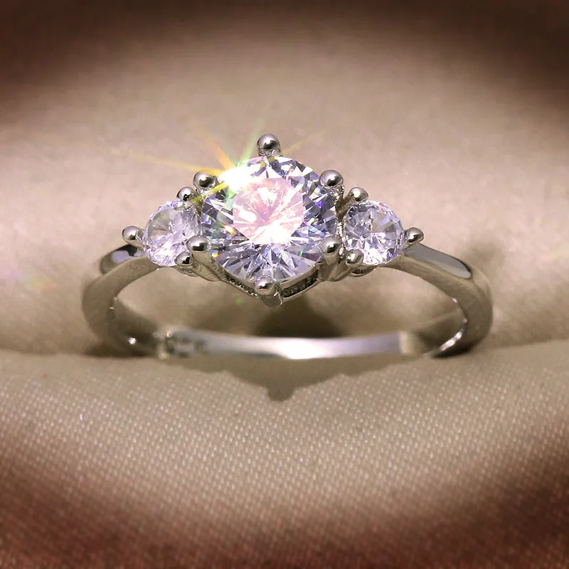 Elegant geometric ring for women featuring white copper base with lab-created moissanite stones totaling approx 0.9 carat weight