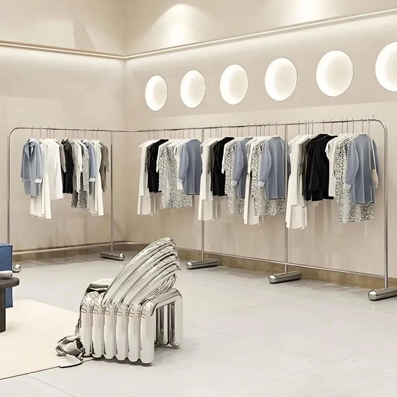 custom.New Design Luxurious Wall Mounted Shiny Gold Stainless Steel Customize Clothes Display Rack Clothing Store