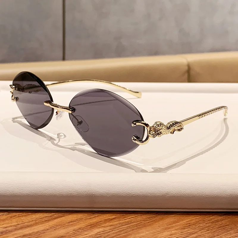 Unisex Rimless Oval Leopard Sunglasses Luxury Brand Designer Punk Style Metal Leopard Temple UV400 Celebrity Fashion Eyewea