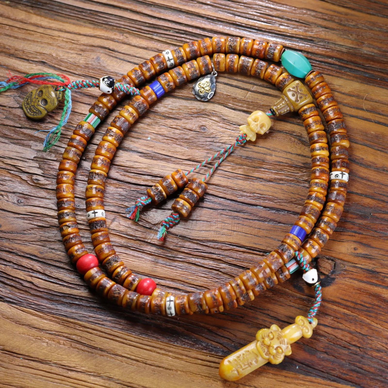 

Tibetan oil yak bone skull cap bone 108 barrel beads Buddha bead chain diy turquoise glaze string bracelet bracelet jumper chain