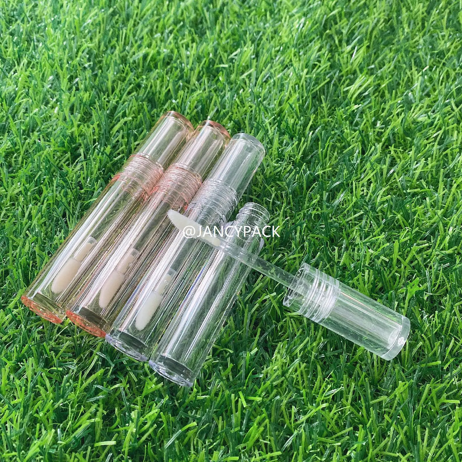 Botella de aceite de labios delgada, redonda, totalmente transparente, logotipo personalizado, embalaje de tubos de brillo de labios transparentes de plástico vacío, 2ml