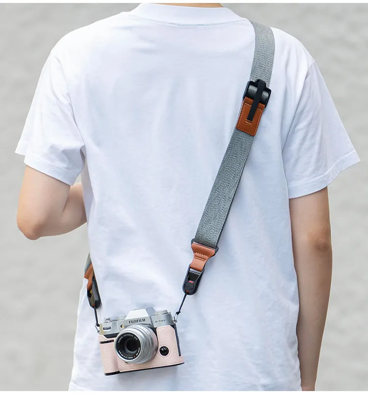 The camera cross-body strap is quick-release and suitable for most DSLR cameras. It features a pressure-relieving shoulder strap