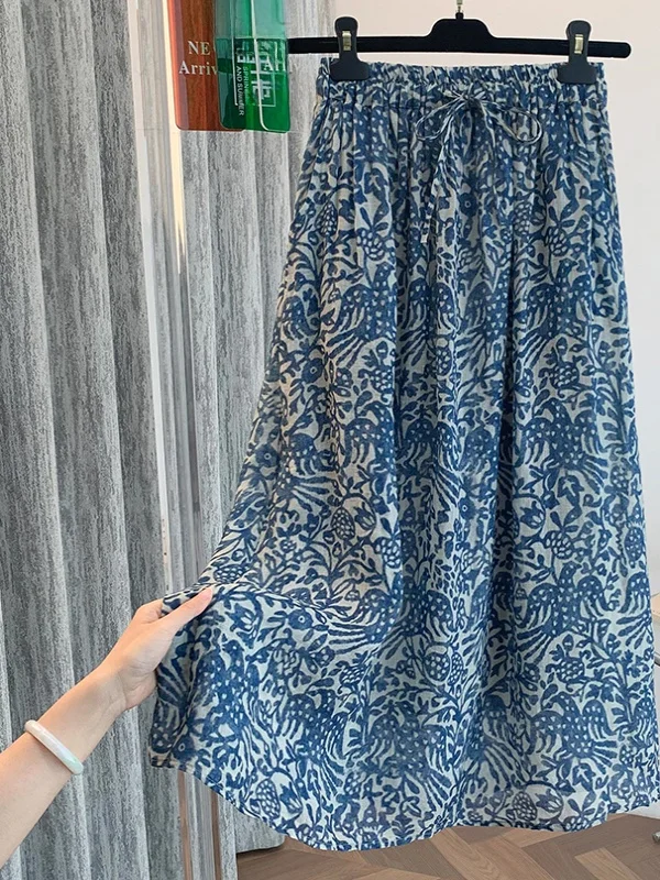 تنورة نسائية صيفية بخصر عالٍ وقصة A-Line، مطبوعة، مقاس كبير، فضفاضة، من القطن والكتان، بخصر برباط، تُساعد على إخفاء عيوب الجس...