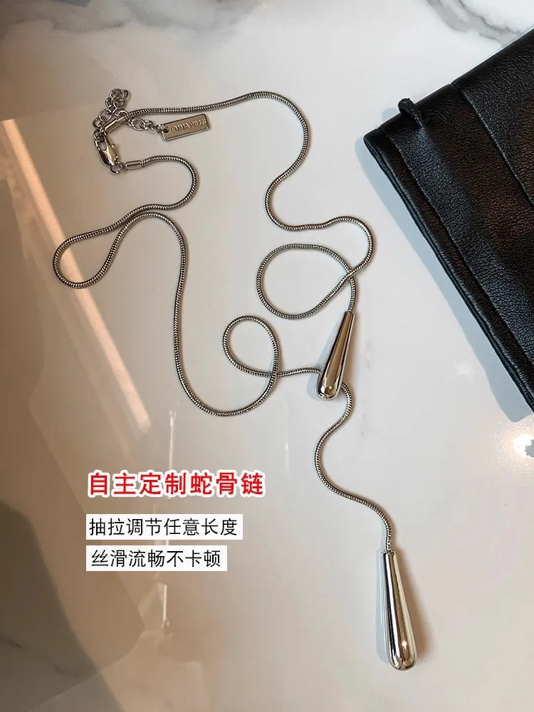 Y Europäische und amerikanische minimalistische lange goldene silberne ausziehbare Schlangenknochenkette mit Wassertropfen-Anhänger-Halskette für Frauen