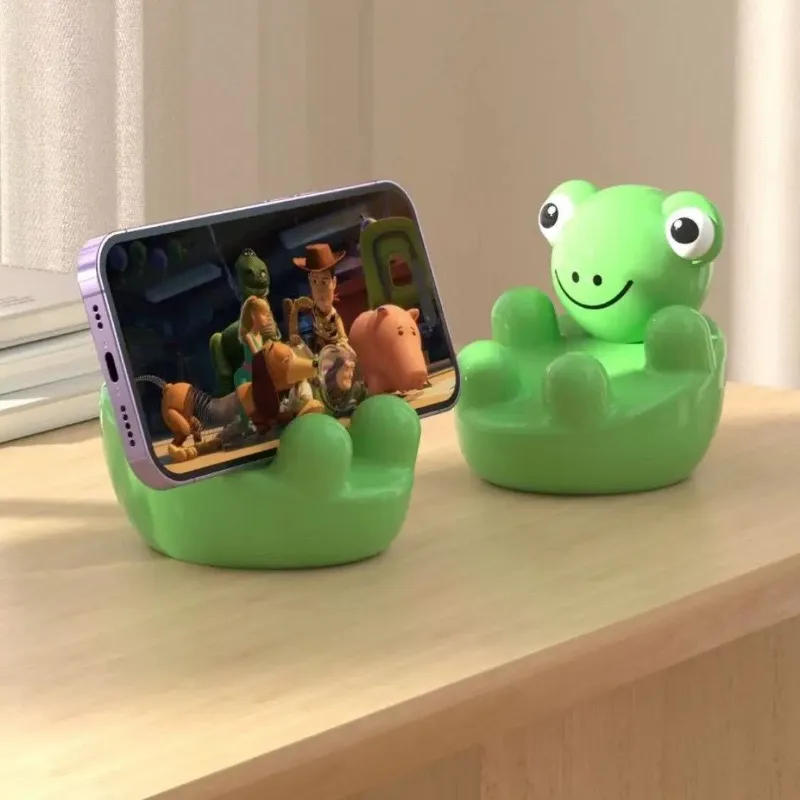 

Держатель для телефона с изображением маленькой лягушки, милые подставки для настольного телефона в прямом эфире, офисное украшение, модный забавный подарок другу на день рождения