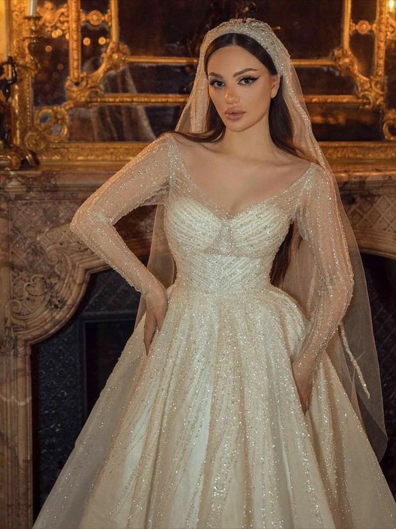 Elegant Sequined Wedding Dresses A Line V Neck Long Sleeve Summer Beach Bridal Gowns Sweep Train Illusion Bride Dress