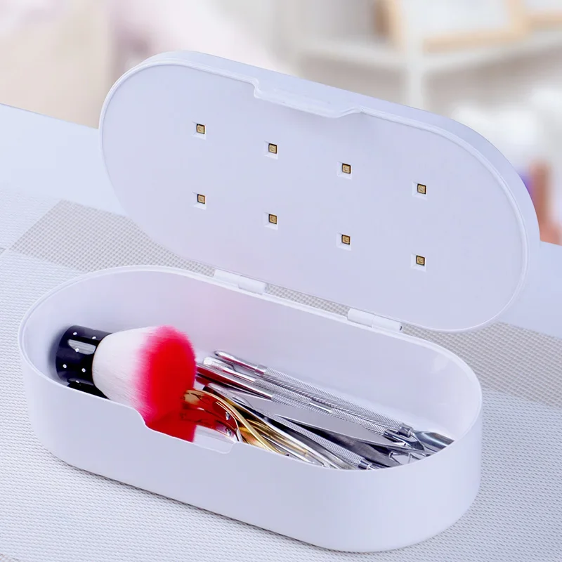 กล่องฆ่าเชื้อโรคในชั้นวางอุปกรณ์ไฟฟ้าแบบพกพากล่องฆ่าเชื้อด้วยเครื่องมือทำเล็บไร้สายแบบมัลติฟังก์ชันกล่องฆ่าเชื้อด้วยรังสีอัลตราไวโอเลต