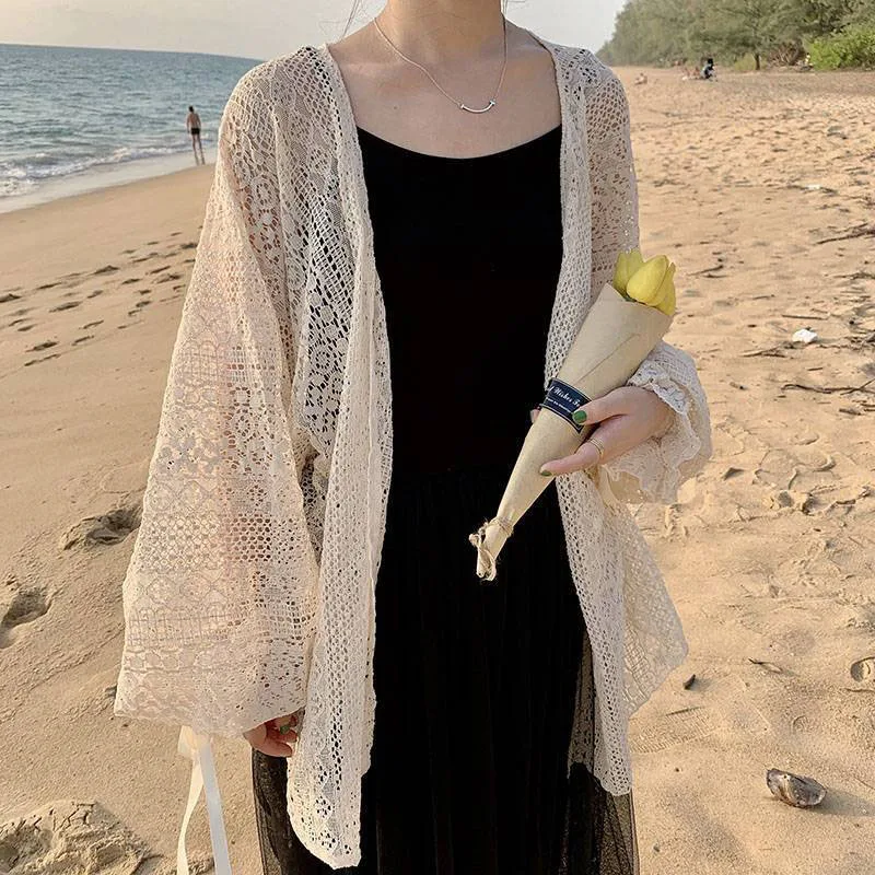 Summer sweet thin sunscreen cardigan female Korean lace-up openwork blouse female holiday beach daily long sleeve blouse