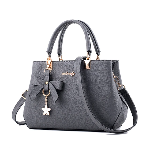 Yogodlns eleganckie damskie torby kurierskie z zawieszką w kształcie kwiatu biurowe damskie skrzynki czysta torebka dla kobiet torby na ramię typu crossbody