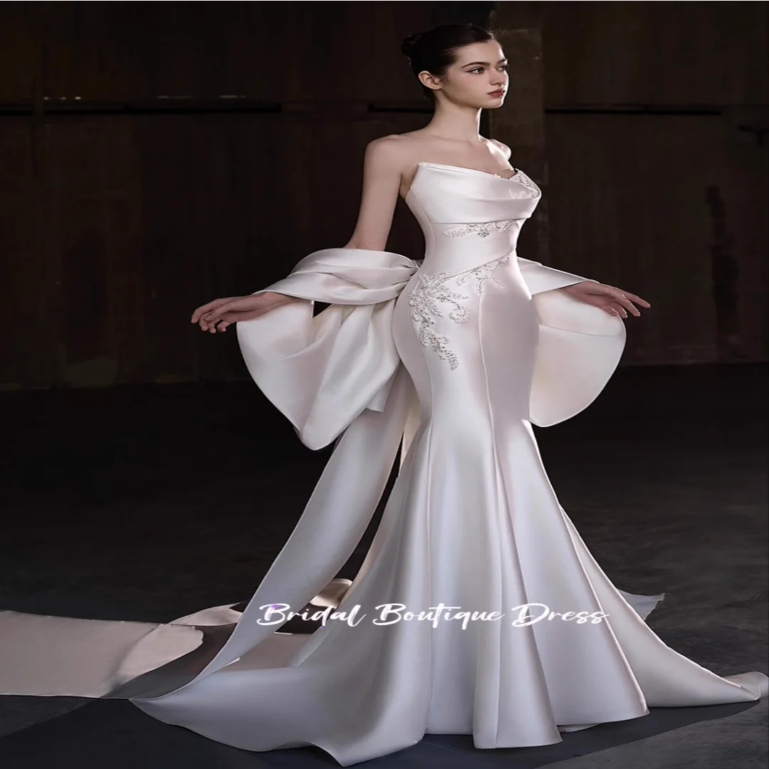 Vestidos de novia sin mangas de satén con cuentas y escote en forma de corazón personalizados, vestido de fiesta de princesa con lazo grande en la espalda