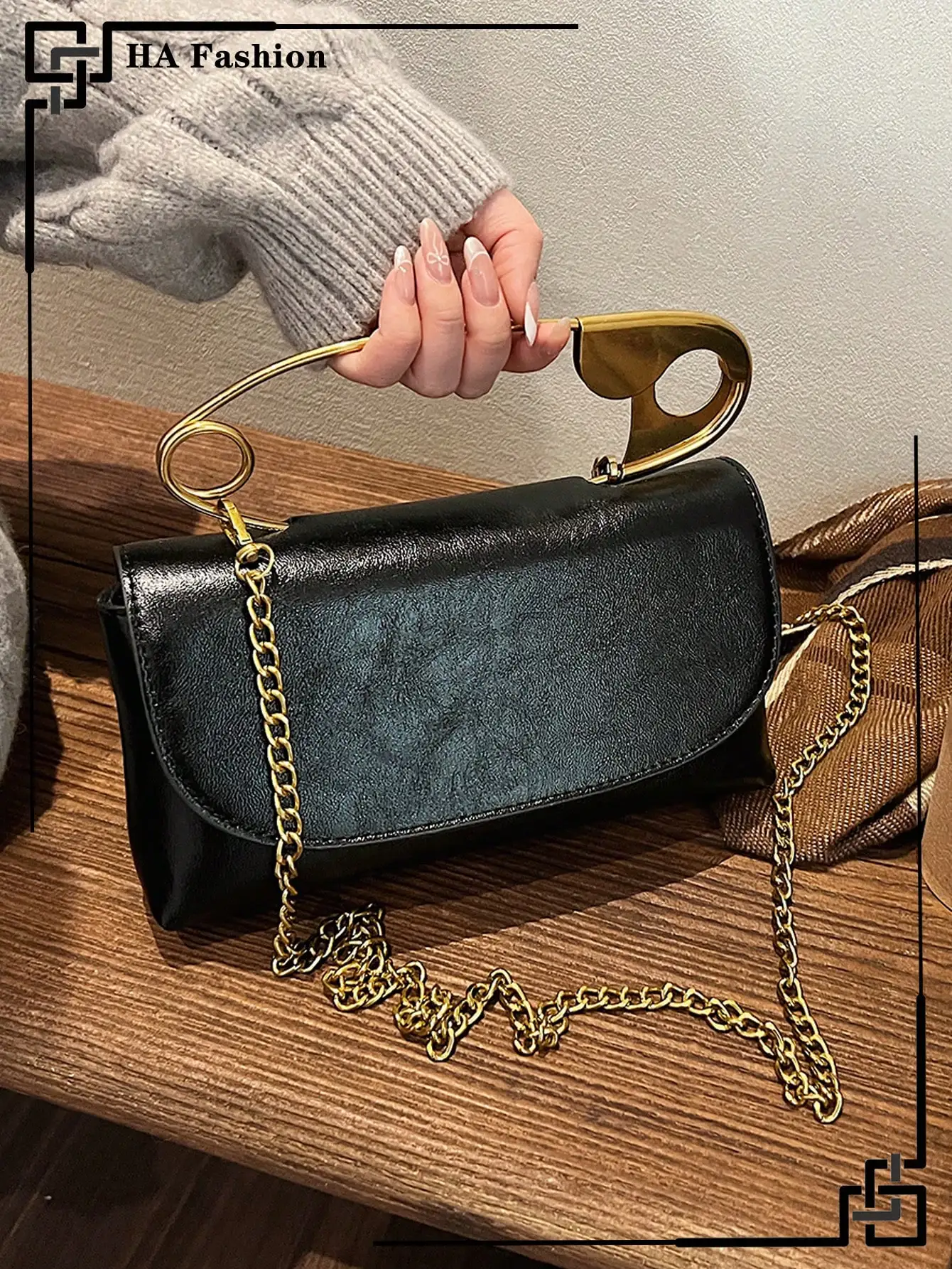 

Black Faux Leather Top-Handle Bag with Gold Chain Strap and Ring Handle