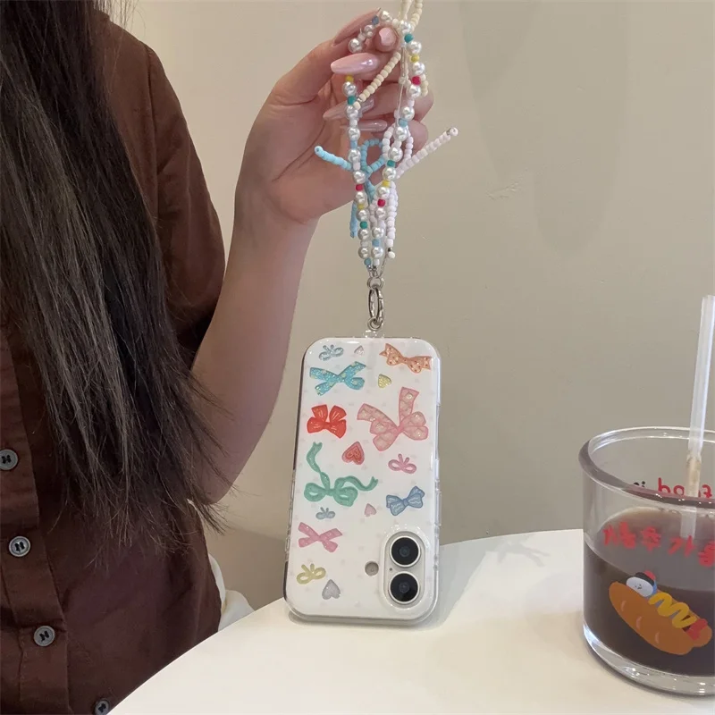 Custodia per telefono Bowknot di colore coreano di moda per iPhone 17 Pro 16 15 14 Pro Max Cover posteriore con cinturino a catena Simpatico cartone animato protettivo C
