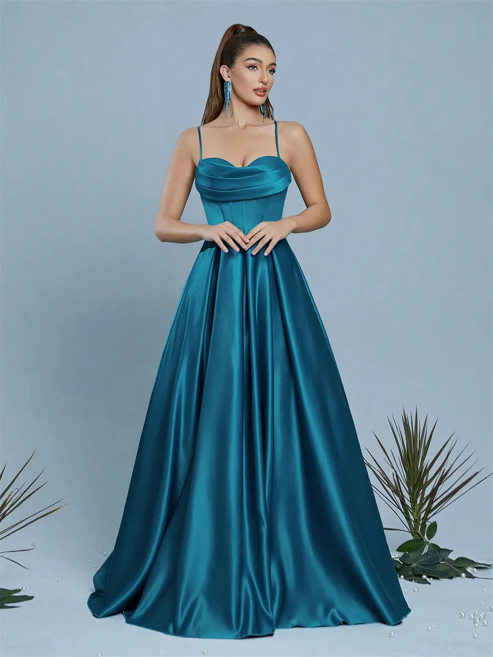 Customized strapless floor-length gown with premium texture and fresh hue. Smooth draping skirt and fine tailoring show gentle a