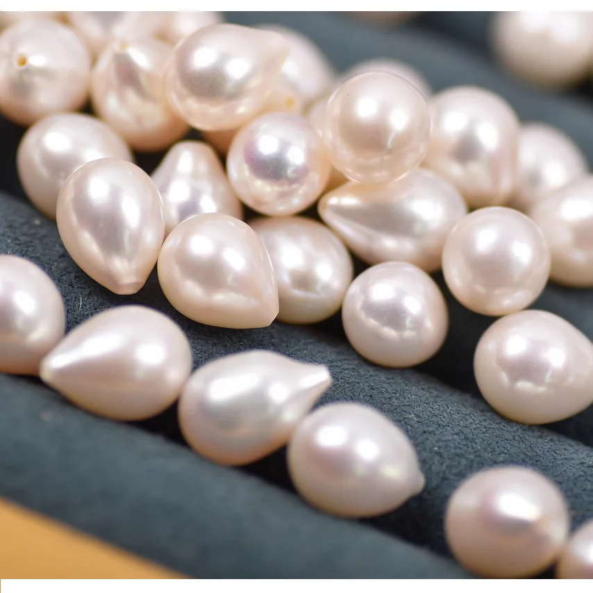 PAIR OF 10X16MM SOUTH SEA WHITE CULTURED PEARL HALF DRILLED