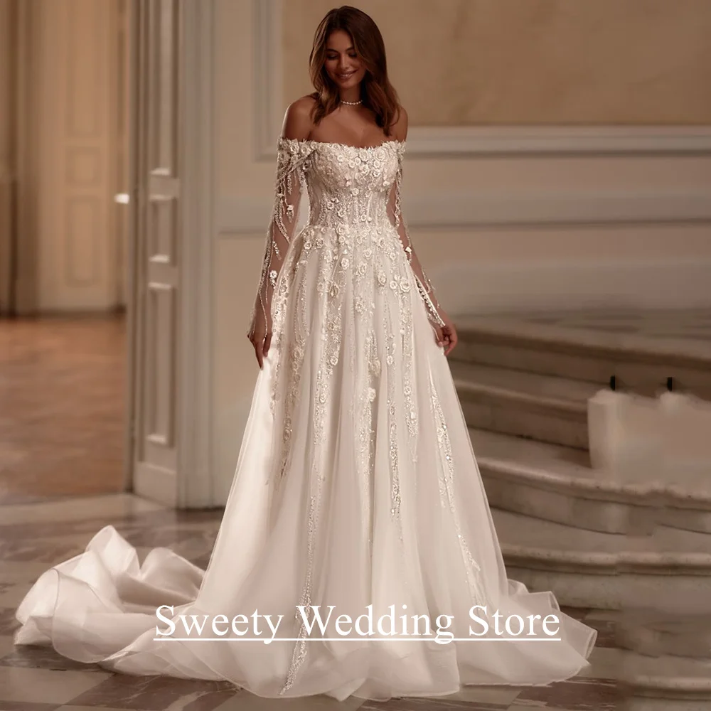 Romantisches Tüll-Hochzeitskleid, maßgeschneidert, U-Boot-Ausschnitt, lange Ärmel, funkelnde Perlen, Blumen, Applikation, Illusionsrücken, Brautkleid