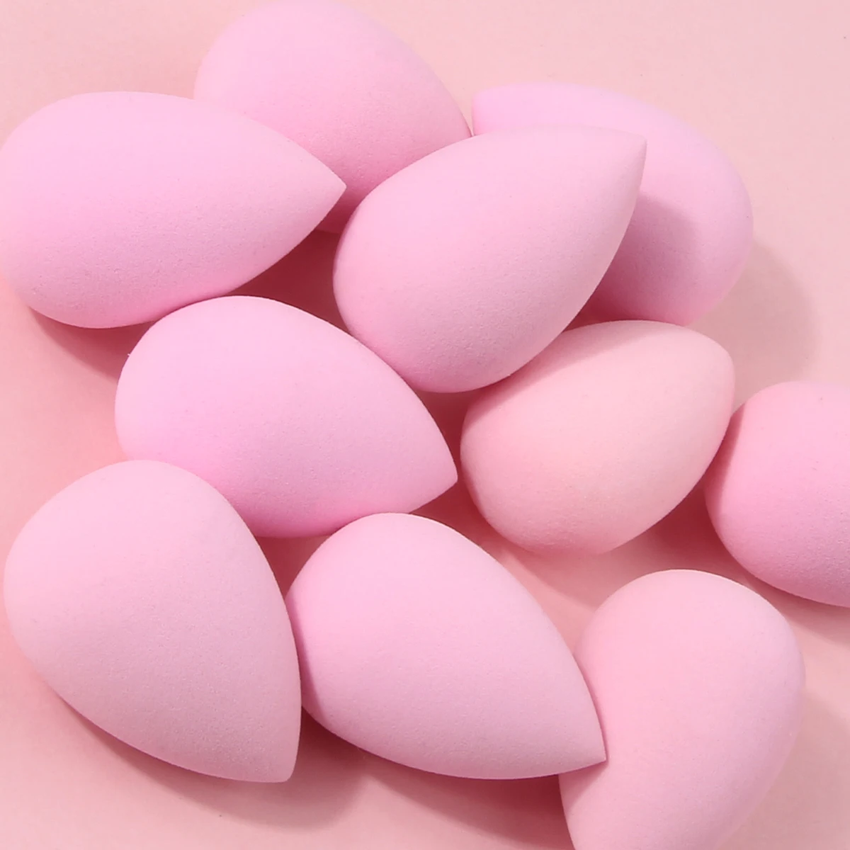 Juego de mini huevos de esponja de maquillaje rosa, 10 Uds., que se exponen al agua, es una herramienta de maquillaje facial natural para aplicar el maquillaje