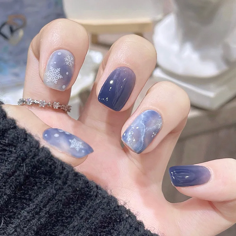 

24Pcs Snowflake Print Press on Nails Icy Blue Ombre with Marble Design Short Square Fake Nails Full Cover Wearable Manicure Set