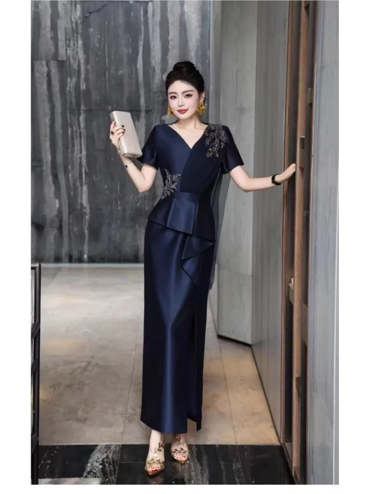 A slim-fitting diamond-encrusted long dress with elegant charm and beaded design