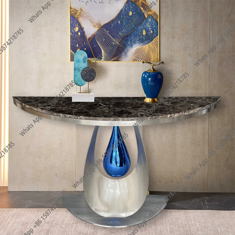 Entering the door, facing the door, rock slab porch table, light luxury against the wall, luxury atmospheric stainless steel
