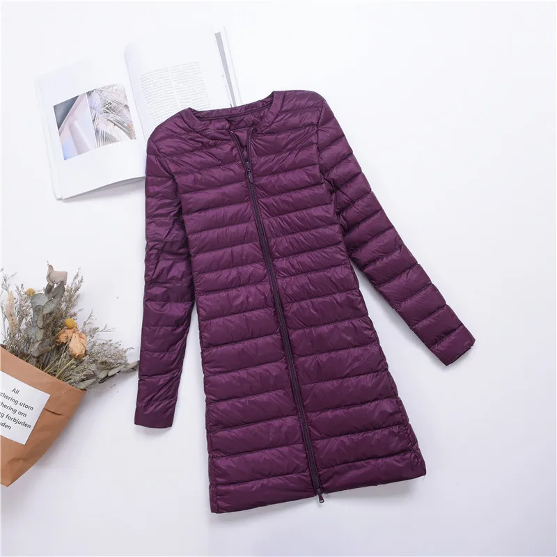 

Sleek mid-length puffer. Snap-front & white duck down for a flattering, warm layer. Korean-inspired design.