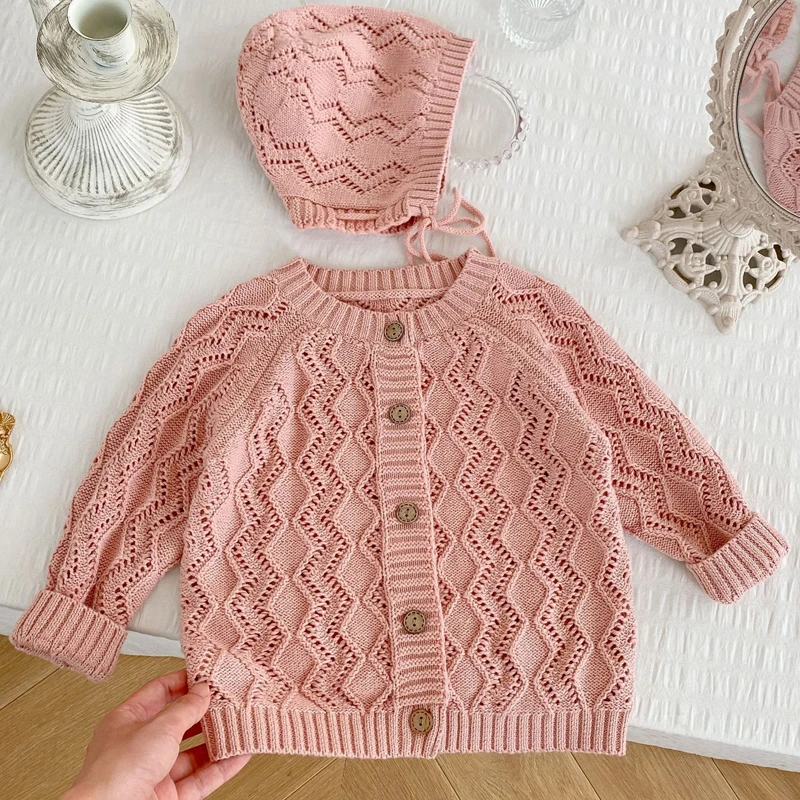 Nuovi vestiti per bambini autunnali, ragazze di 0-3 anni, cappello di filato di cotone lavorato a maglia scavato in tinta unita