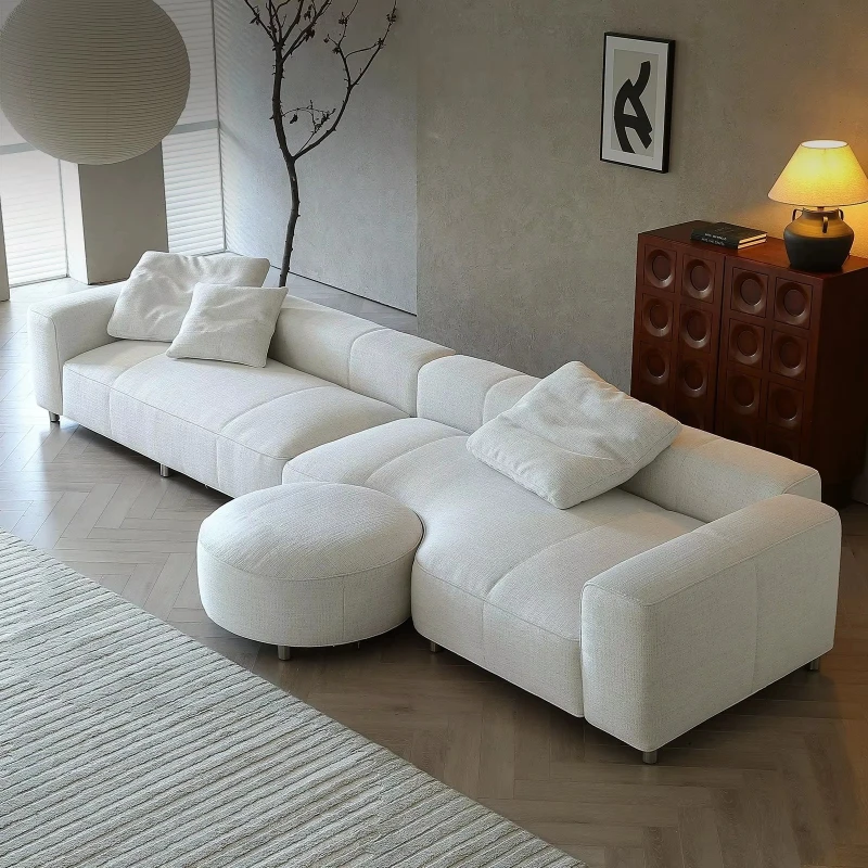 Italian minimalist cotton and linen upholstered sofa with wabi-sabi style and straight strips filled with down.