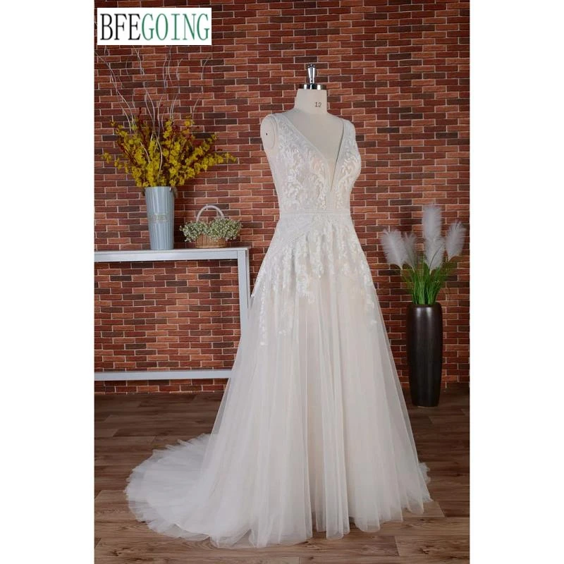 Vestidos de novia de una línea Cola capilla Vestidos de novia con apliques de encaje sin mangas hasta el suelo con cuello en V personalizados