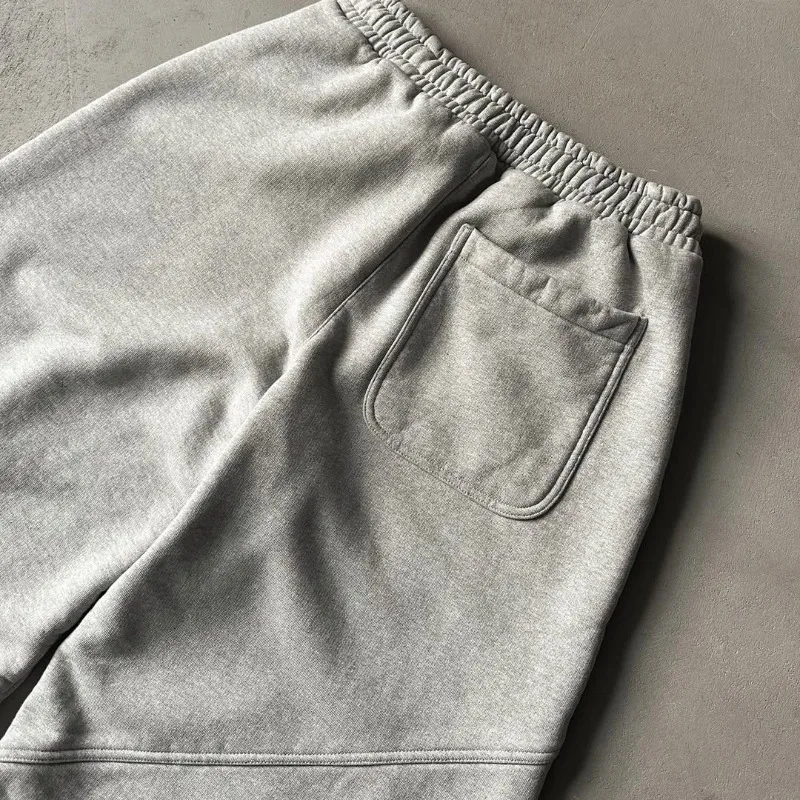 Pantalones de chándal con cordón y patrón bordado de estilo americano para hombres y mujeres, pantalones informales sueltos de pierna ancha de Hip-hop de calle alta para parejas
