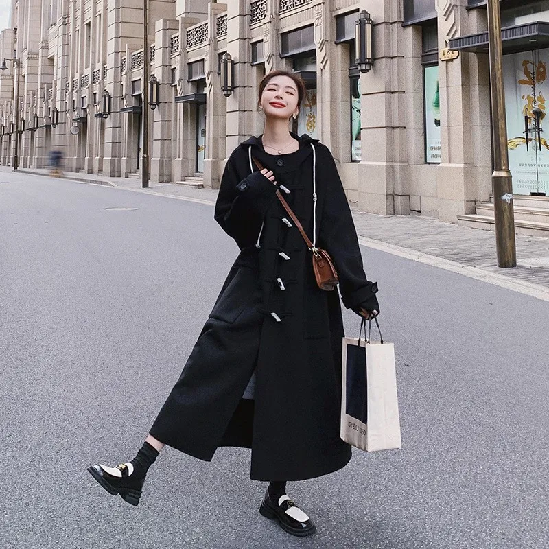 

Hepburn style black hooded woolen coat for women mid-length loose thickened cape horn-buttoned
